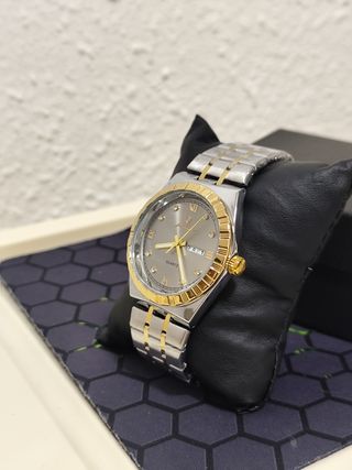 Reloj hombre dorado y plateado