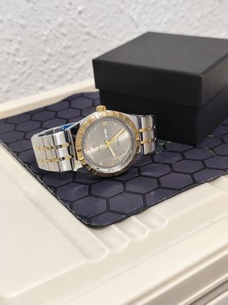 Reloj hombre dorado y plateado