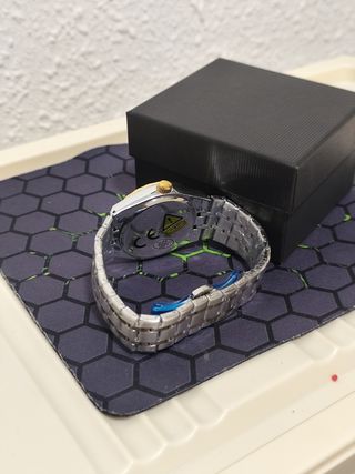Reloj hombre dorado y plateado