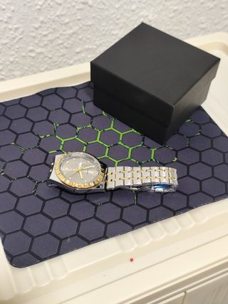 Reloj hombre dorado y plateado