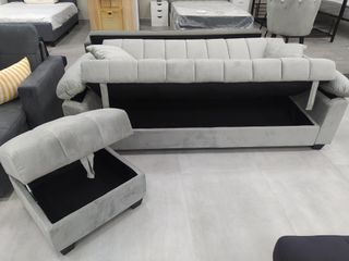 Sofá cama gris con puff