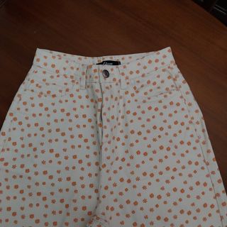 Pantalones estampados flores naranja etam