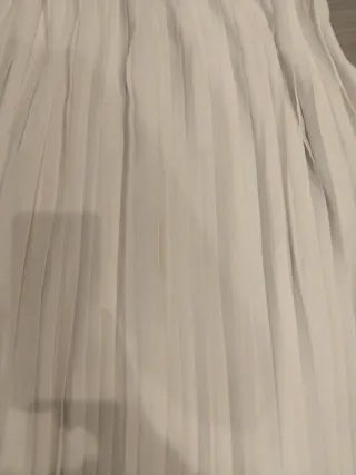 Falda larga blanca plisada