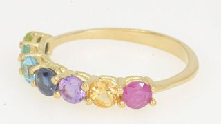 Anillo de oro de 18 kt con esmeralda, topacio...