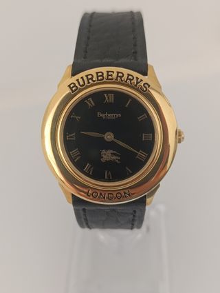 Reloj Burberrys de oro y correa negra