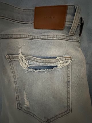 Jeans skinny strappati blu