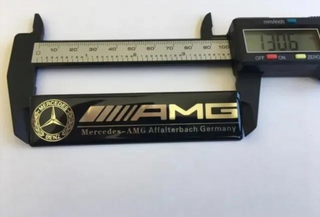 EMBLEMA AMG NEGRO SILICONA MERCEDES LOGO INTERIOR