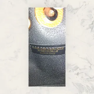 Bolso “Siena” de piel marrón tipo saco con flecos