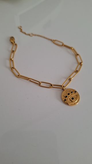 Pulsera Parfois ojo dorado y negro