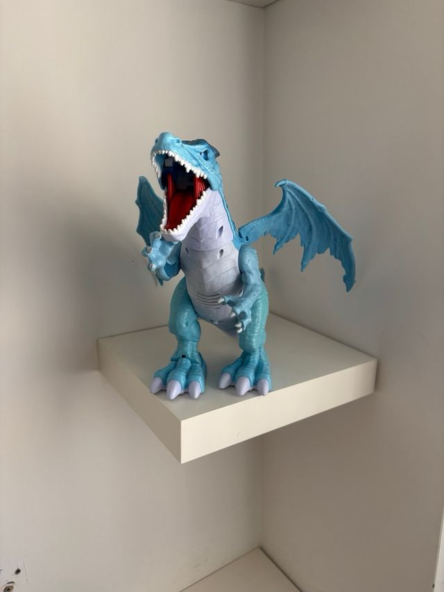Dragón azul con movimiento y sonido para niños