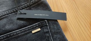 Jeans Amiri neri strappati con stampa angelo Nuovi