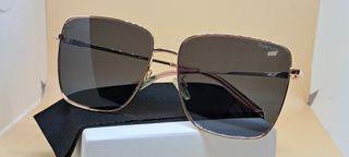 Gafas de sol Polaroid doradas y rosas