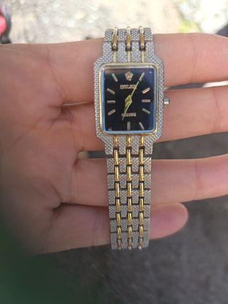 Reloj Rolex Dorado y Negro