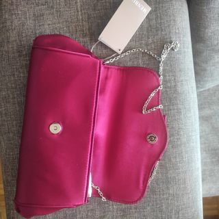 Cartera de mano ceremonia fucsia