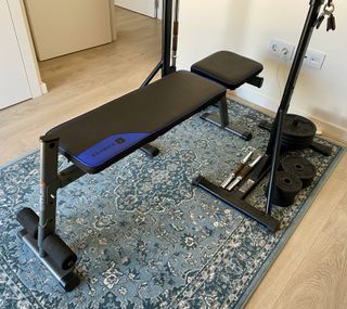 Banco de pesas con soporte y discos