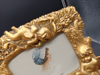 Portafoto dorato con angeli