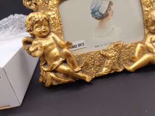Portafoto dorato con angeli