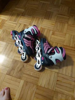 Patines en línea rosas y negros