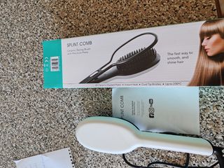 Cepillo de peinar eléctrico negro