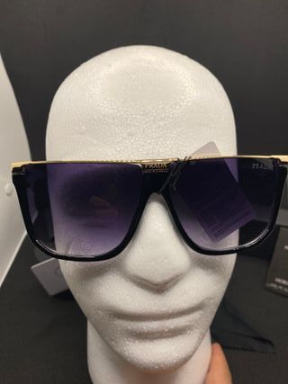 Occhiali da sole Prada neri e oro