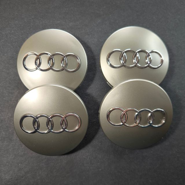 TAPABUJES AUDI 68mm GRIS - EMBLEMA LLANTAS AUDI
