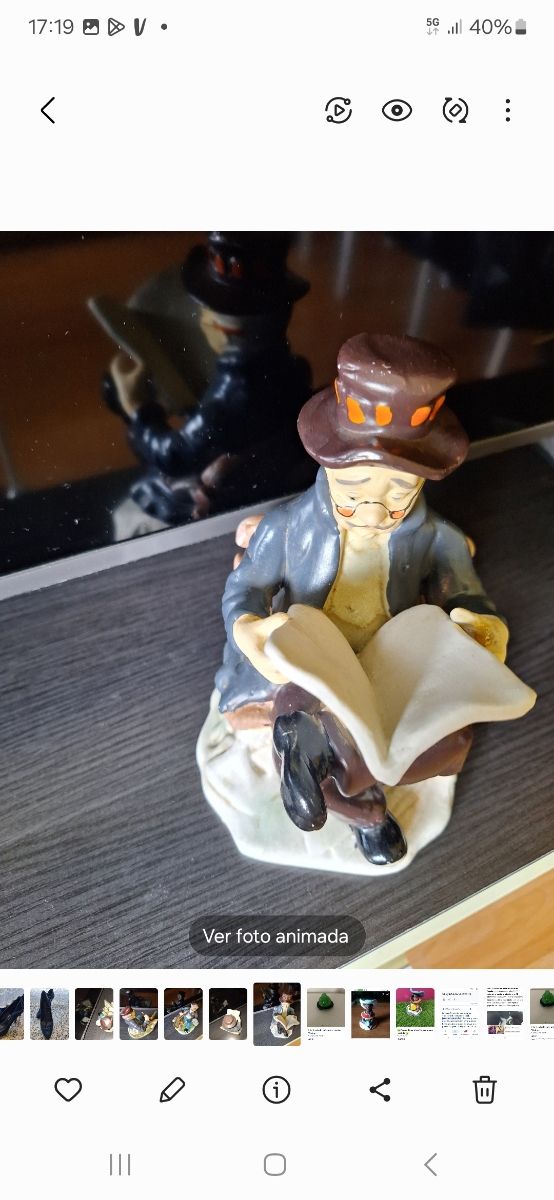 Figura abuelo leyendo cerámica