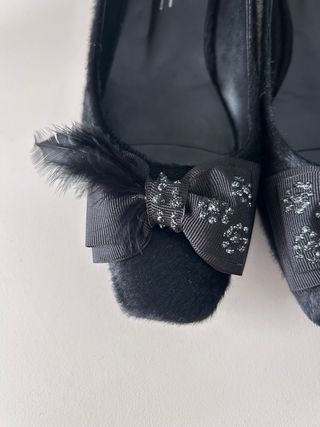 Bailarinas pelo y plumas negras