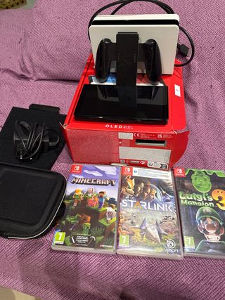 Nintendo Switch OLED bianco + custodia + giochi + ricarica