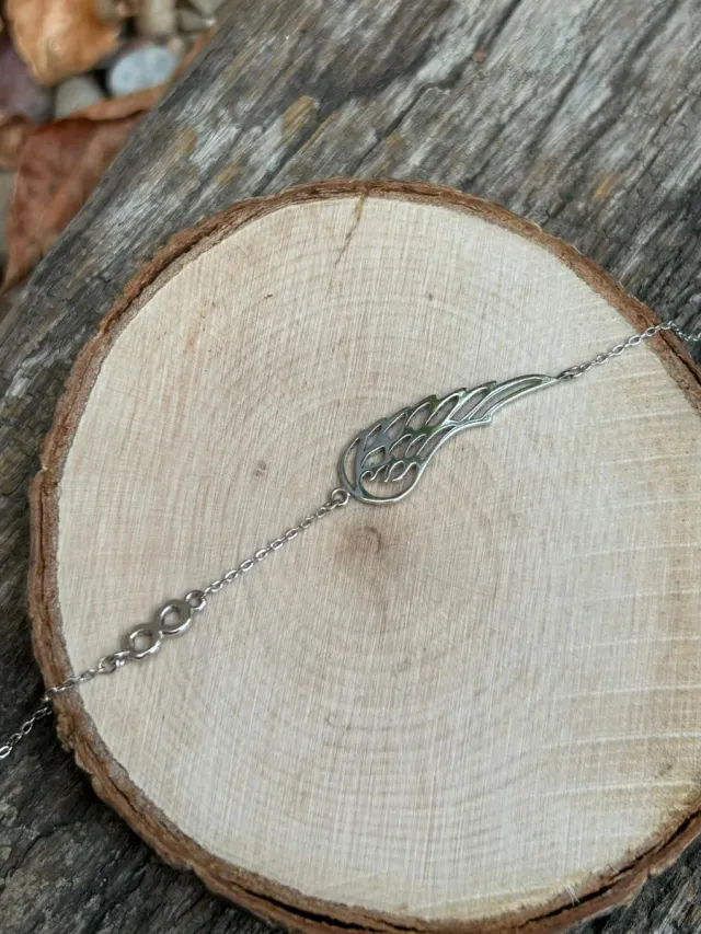 Pulsera plata detalle ala