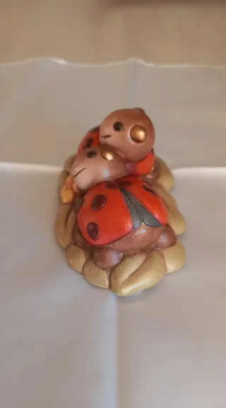 Coccinelle con fiore Thun