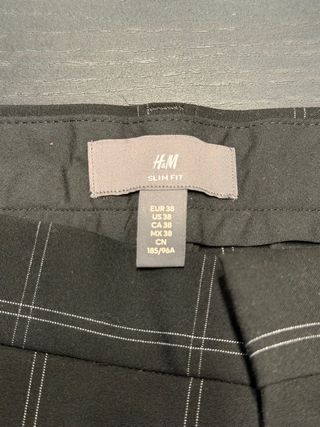 Pantalones de cuadros negros a estrenar