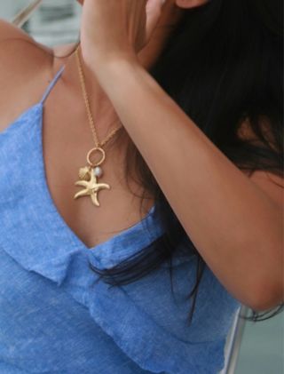 Collar con colgante de estrella de mar y perla