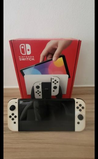 Nintendo Switch White OLED+8 Giochi e accessori
