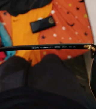 Gafas de sol Ray-Ban Clubmaster negras y doradas