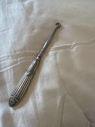 Antigua herramienta de plata para manicura