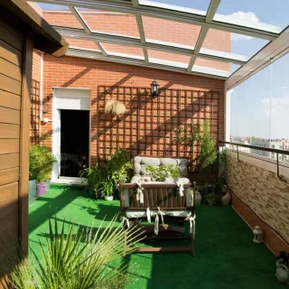 Terraza acristalada retráctil