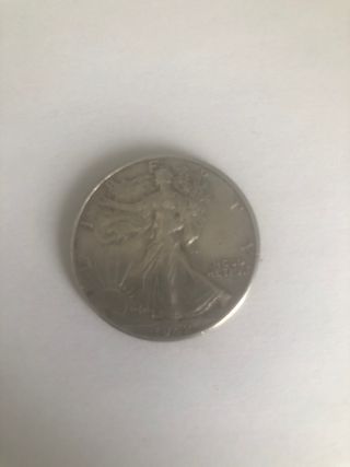 Moneda medio dólar plata
