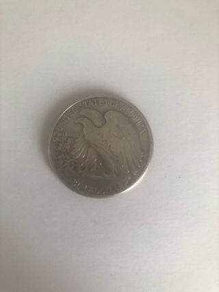 Moneda medio dólar plata