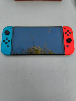 Nintendo Switch OLED Azul/Roja Impecable