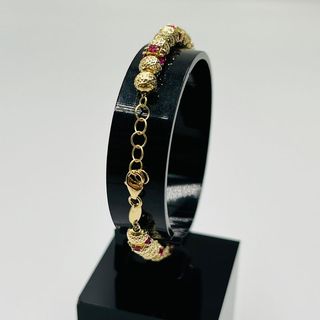 PULSERA BOLAS DIAMANTADAS Y PIEDRAS ROJAS.