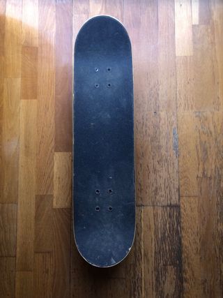 Skate Oxelo con pegatinas Vans