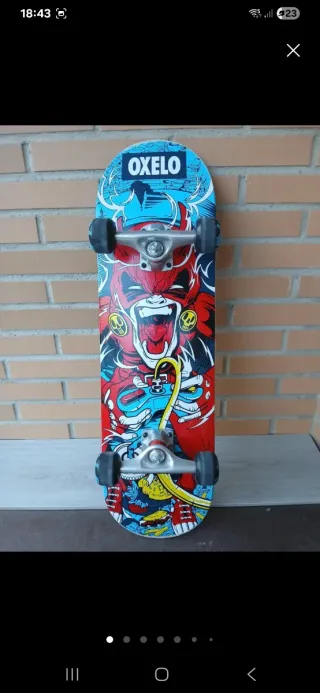 Patinete Oxelo con diseño de mono