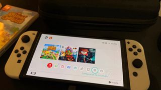 Nintendo Switch OLED bianco + custodia + 2 giochi