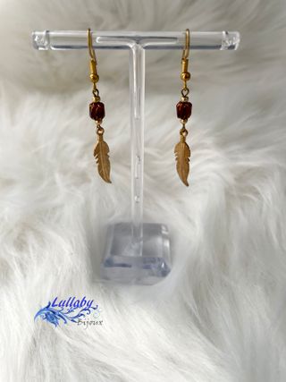 Pendientes pluma dorados