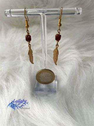 Pendientes pluma dorados