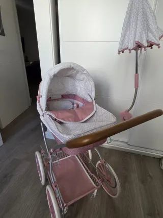 Carrito de muñecas rosa y blanco con accesorios
