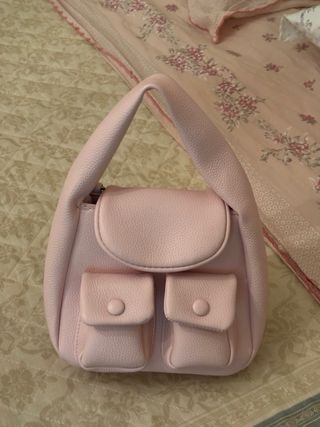 Borsa rosa con tasche