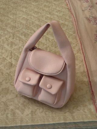 Borsa rosa con tasche