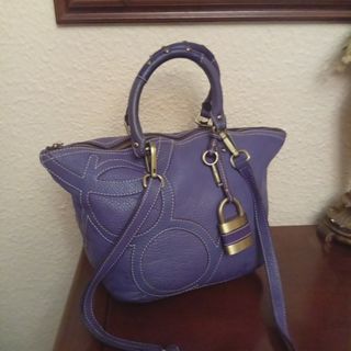 Bolso Purificación García morado piel con bandoler