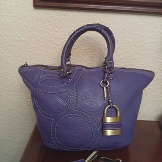 Bolso Purificación García morado piel con bandoler